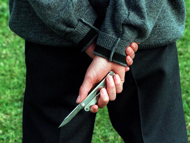 Gang member and student from Sarah Redfern High at Minto carries a knife to school. NSW / Education / Teenagers / Gangs / Knives weapons protection youth crime violence juvenile generic