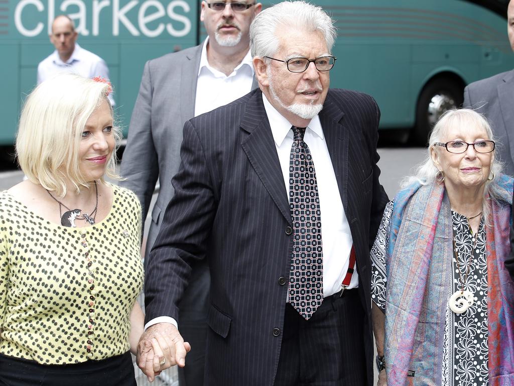 Rolf Harris with his daughter Bindi (left) and wife Alwen (right) outside a London court in 2014. Picture: Alex Huckle/GC Images