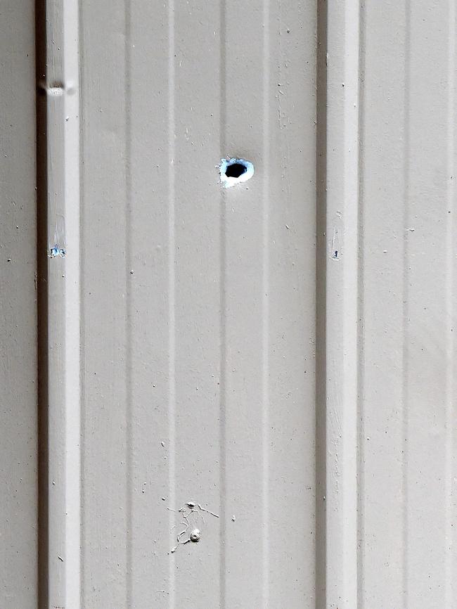 Shots were fired into a garage door and through an upstairs window. Picture: Lawrence Pinder