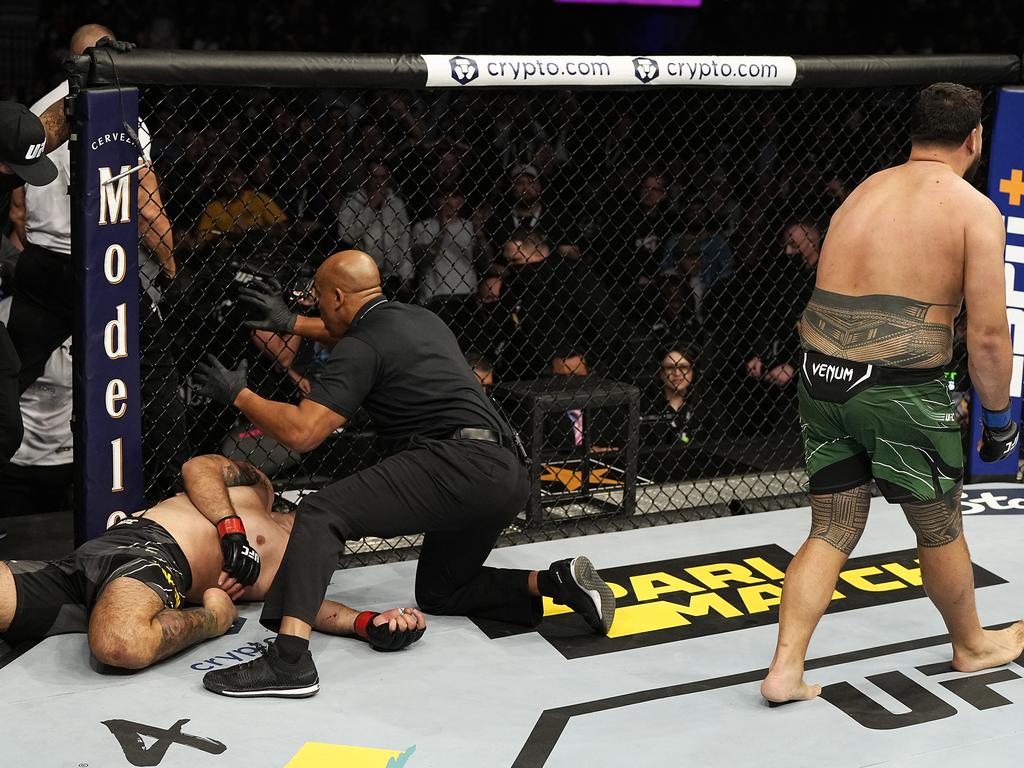 Sakai is left lying on the canvas as Tuivasa celebrates a fourth consecutive win. Picture: Jeff Bottari/Zuffa/Getty