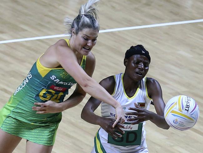 Australia's Gretel Tippett, (left) and Zimbabwe's Felisitus Kwangwa compete for the ball. Picture: AP