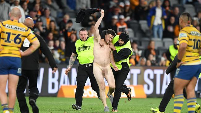 Matthew Cooper streaks during the Round 17 NRL match between the Wests Tigers and the Parramatta Eels at Bankwest Stadium. AAP Image/Joel Carrett