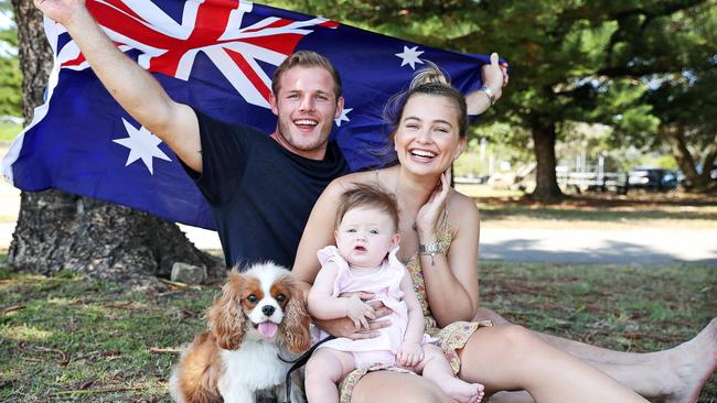 Tom Burgess, pictured with his fiancee Tahlia Giumelli with daughter Sophie, is now an Australian citizen. Picture: Tim Hunter