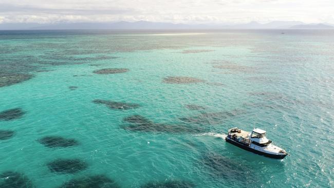 A charter fishing vessel pictured off the coast near Cairns. Picture: Steven Nowakowski