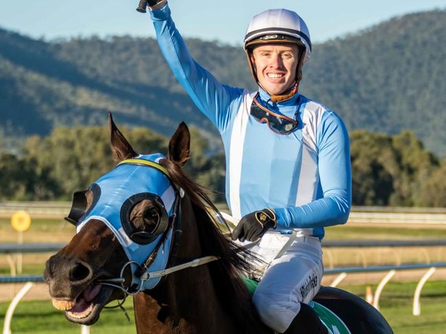 Champion jockey Les Tilley salutes after guiding Master Jamie to victory in the Rockhampton Cup. Photo: Caught In The Act Photography CQ