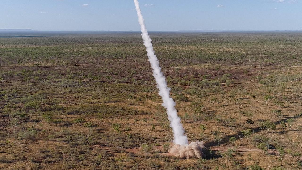 A United States Marine Corps M142 High Mobility Artillery Rocket System (HIMARS), part of the Marine Rotational Force - Darwin, fires a guided rocket against targets on Bradshaw Field Training Area in the Northern Territory. Picture: Petty Officer Peter Thompson/Defence