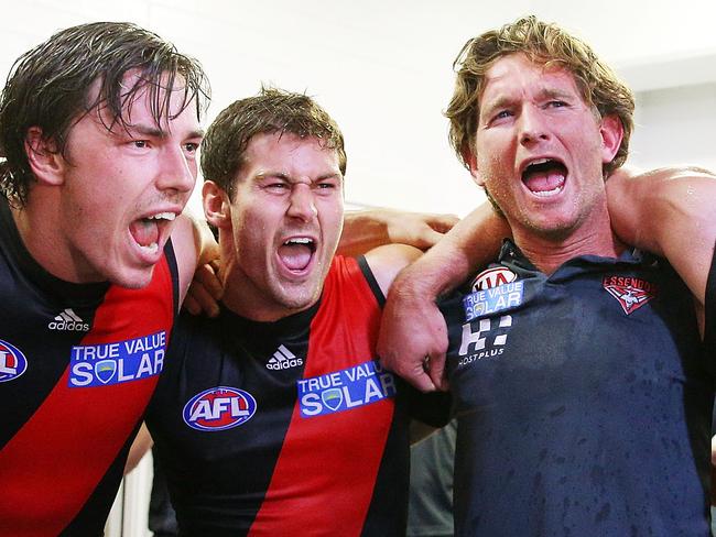 Bombers coach James Hird celebrates the win with Michael Hibberd and Ben Howlett in Round 3, 2013. Photo by Michael Dodge