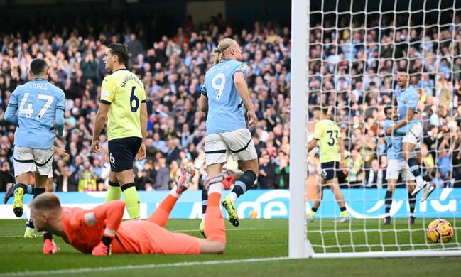 Early strike: Manchester City's Erling Haaland runs to celebrate after scoring the opening goal