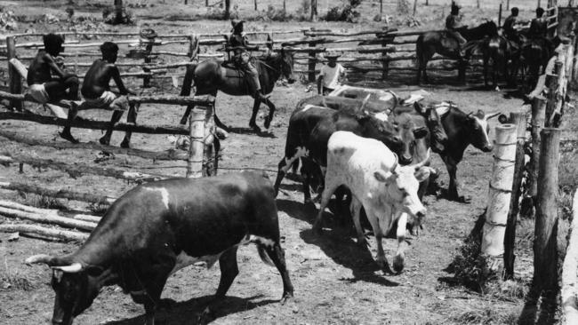 Aboriginal stockmenat a post and rail stockyard in an unnamed Outback location in 1955.