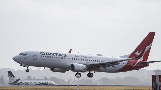 A Qantas aircraft landing at Sydney Airport. Picture: NCA NewsWire / James Gourley