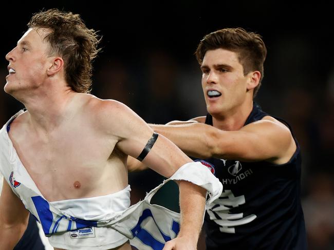 MELBOURNE, AUSTRALIA - APRIL 30: Nick Larkey of the Kangaroos and Lewis Young of the Blues clash during the 2022 AFL Round 07 match between the Carlton Blues and the North Melbourne Kangaroos at Marvel Stadium on April 30, 2022 in Melbourne, Australia. (Photo by Michael Willson/AFL Photos via Getty Images)