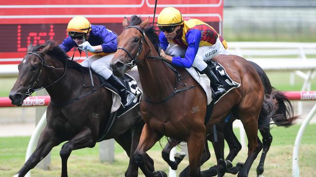 Idyllic Affair (right) zooms past odds-on favourite Boomshanka to win the QTIS 2YO Handicap at Doomben on Saturday. Picture: Natasha Wood/Trackside Photography