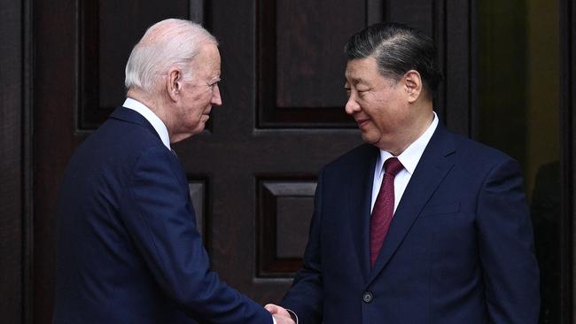 Chinese President Xi Jinping waves as he meets with Joe Biden. Nostradamus potentially predicted a war with China. Picture: AFP