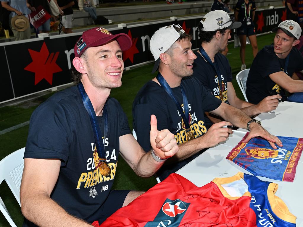 IPSWICH, AUSTRALIA - SEPTEMBER 29: Harris Andrews signs autographs for fans at Brighton Homes Arena, on September 29, 2024, in Ipswich, Australia. The Brisbane Lions won the 2024 AFL Grand Final yesterday beating Sydney Swans at the MCG. (Photo by Bradley Kanaris/Getty Images)