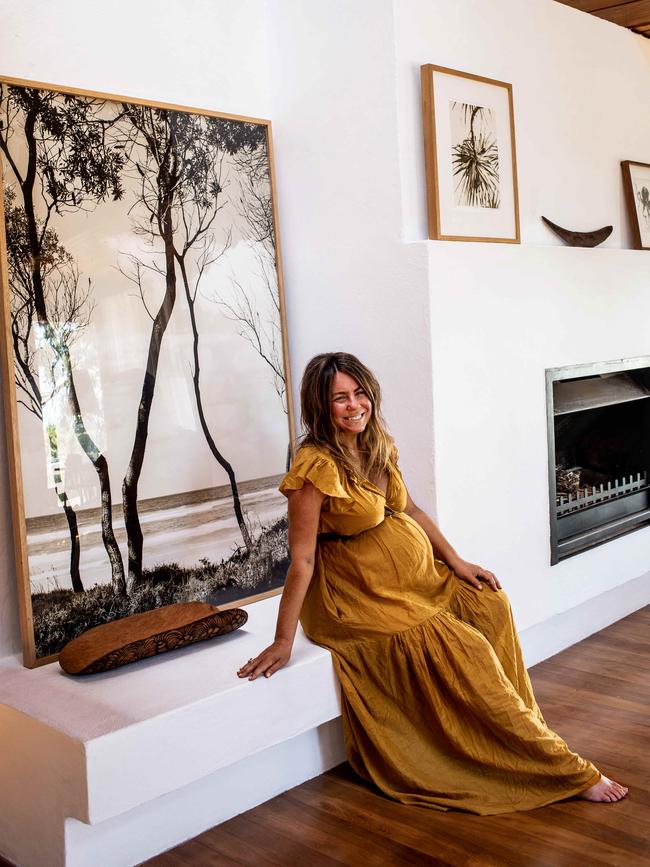 Photographer Kara Rosenlund by the hearth that she built with her father.