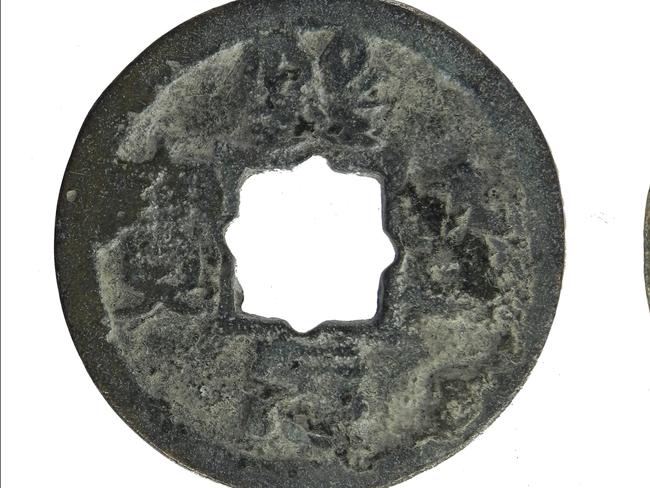 Medieval coin: A worn cast copper alloy Chinese coin, from the Northern Song dynasty (960 AD to 1127 AD), minted during the Xining reign between 1068 and 1077 AD. Chinese characters (inscription- Xining yuanbao) are only present on the obverse. A square hole (7.60mm by 8.05mm internal dimensions) is present at the centre of the coin.