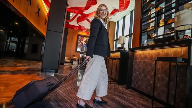 Lola Vancoillie checking in at the lobby. Picture: Tom Huntley.