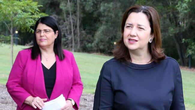 Annastacia Palaszczuk, with Education Minister Grace Grace Minister, says the start of Term 2 will be confusing for many parents. Picture: AAP Image/Richard Gosling