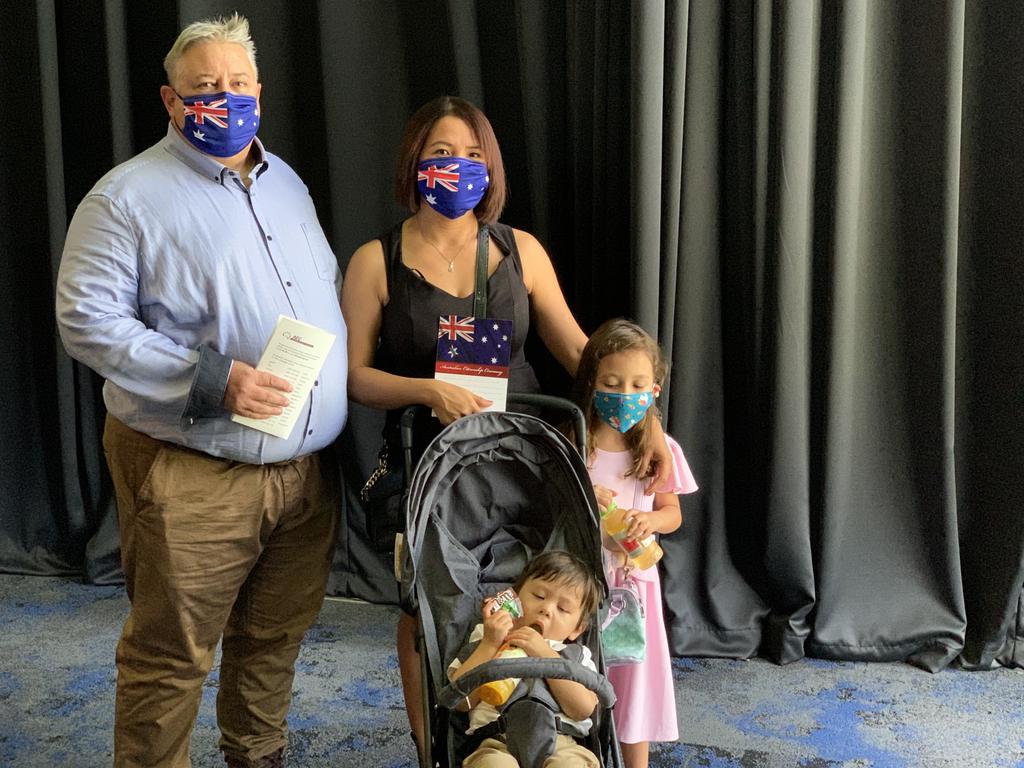 Getting into the Australian spirit are (from left) Trevor Hammond and new citizen Aires with young Jonas and Xochitl at the MECC citizenship ceremony on January 26, 2022. Wednesday, January 26, 2022. Mackay Australia Day 2022. Mackay Citizenship Ceremony 2022. Picture: Duncan Evans