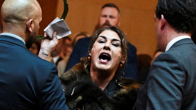 Australian Senator Lidia Thorpe stages a protest as Britain's King Charles and Queen Camilla attend a Parliamentary reception in Canberra, Australia - 21 Oct 2024. Victoria Jones/Pool via REUTERS TPX IMAGES OF THE DAY