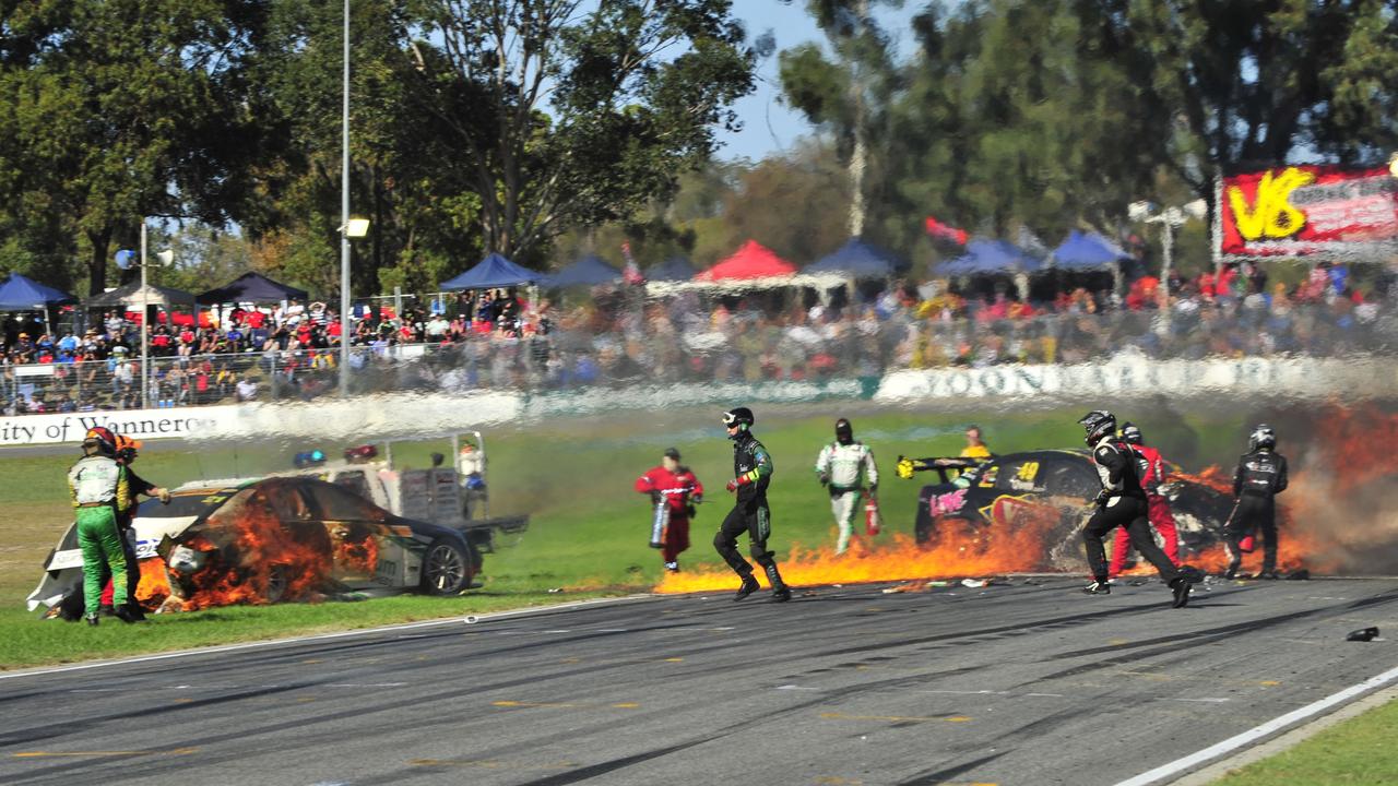 Reindler (left) was initially trapped inside his burning race car. .