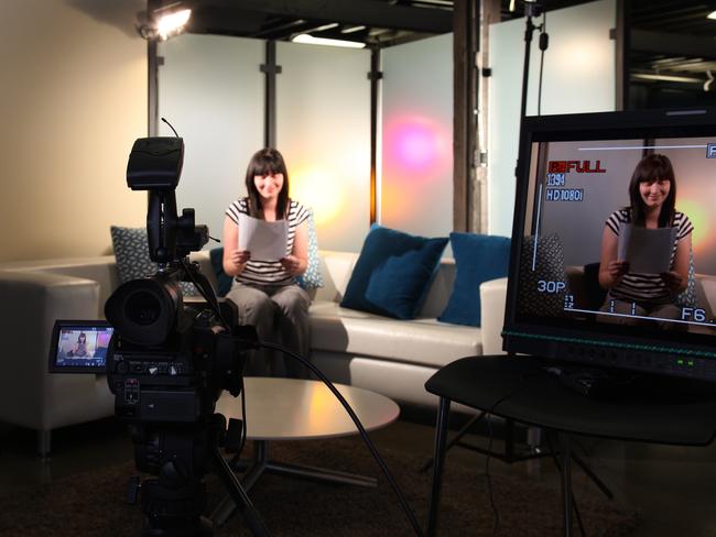 Female host looking over notes preparing for camera to roll.istock brisbane news