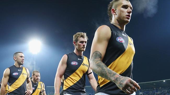 Dustin Martin leads Richmond players off the field in Hobart.