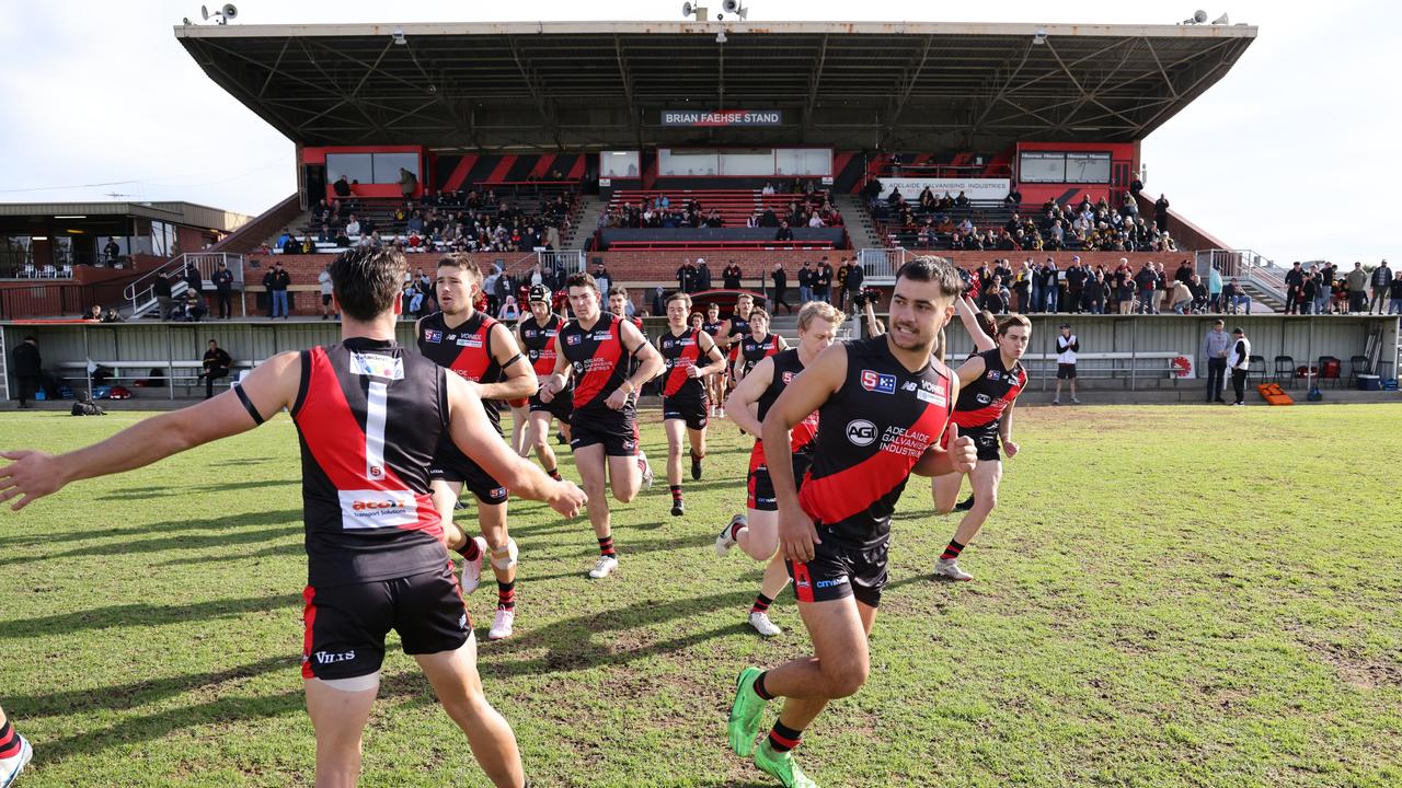 West Adelaide players run onto Richmond Oval for the Round 11 SANFL game against Glenelg last season. Picture: David Mariuz/SANFL