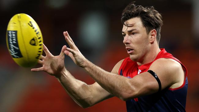 Michael Hibberd gathers the ball for the Demons . Pic: Michael Klein