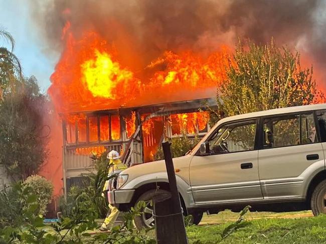 Fire investigators assess scene after home gutted by blaze