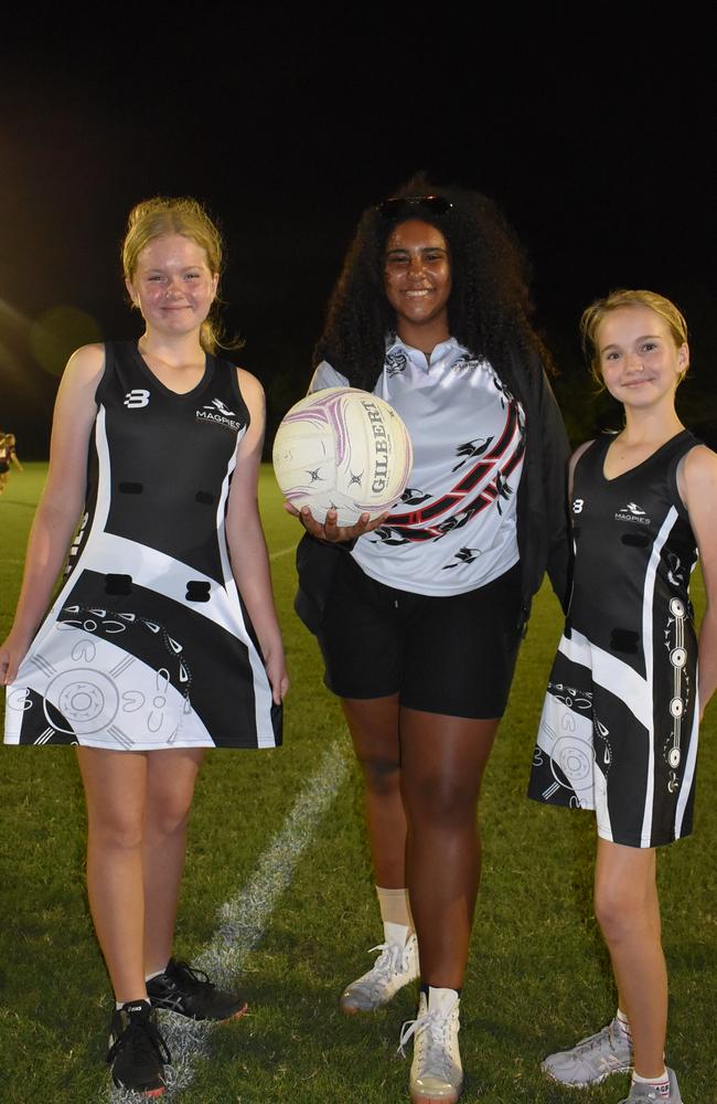 Abbey Williams, 12, Olivia Bellear, 15, and Hannah Williams, 10. Olivia designed the Magpies' 2022 uniform with the Indigenous art representing the club's values and player progress. Magpies Netball Club 2022 season launch, Saturday, March 19, 2022. Picture: Tara Miko