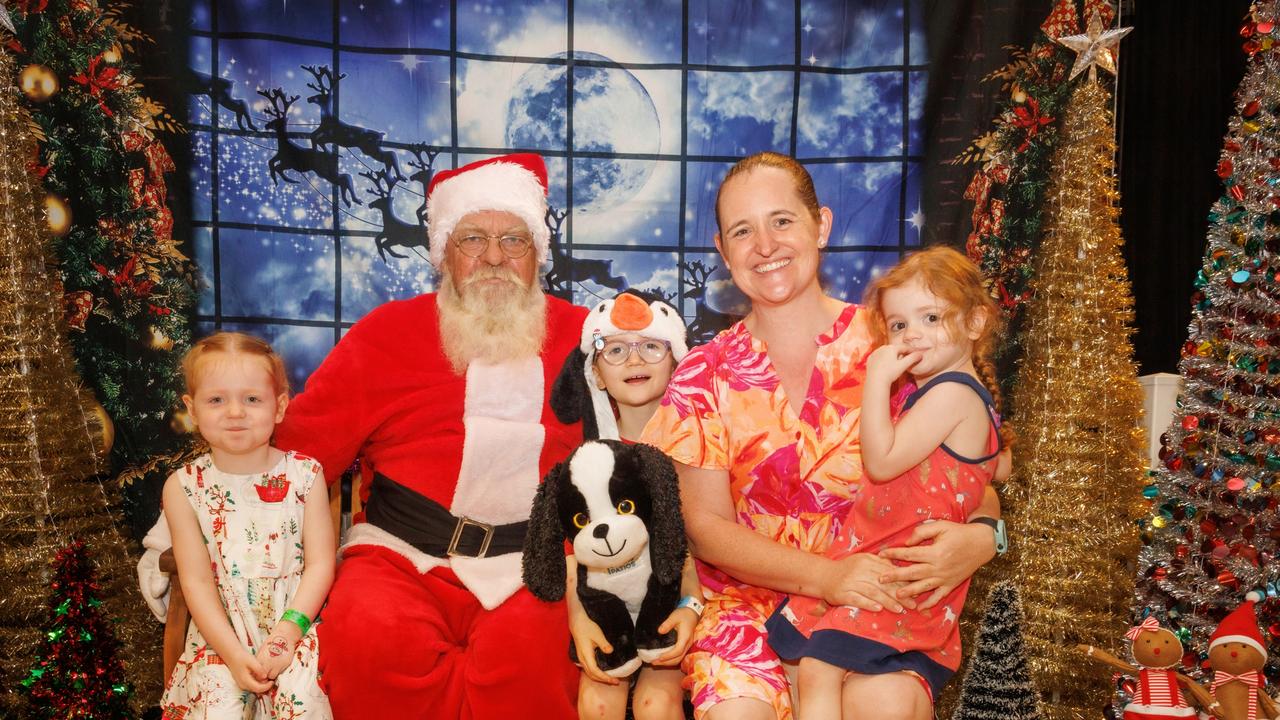 Santa at the Cairns Special Children's Christmas Party with special kids Charlotte, Madeleine, Alison and Annabelle Armistead. Picture: Colyn Huber