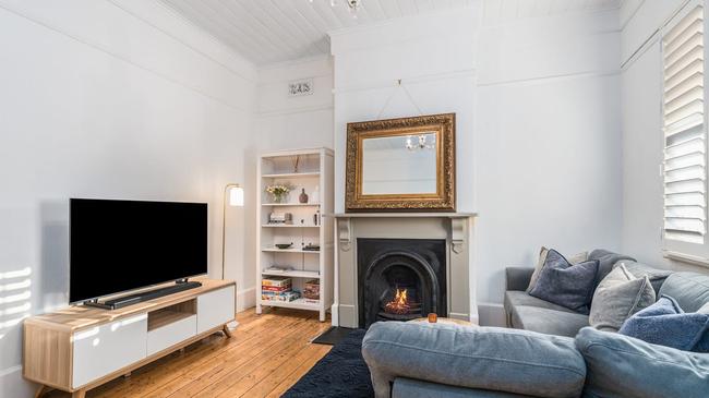 High ceilings, an open fireplace and plantation shutters are showcases in the renovation.