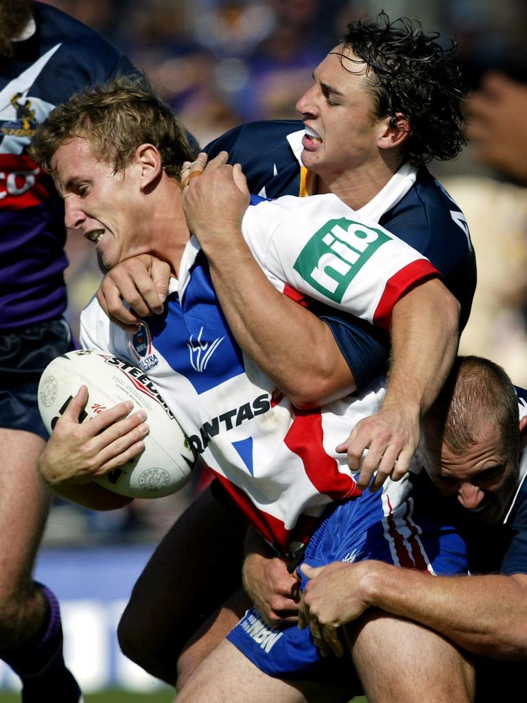 Seage gets tackled by Billy Slater in 2004.