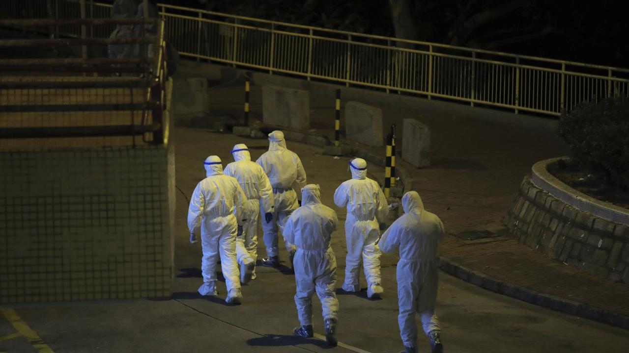 There are fears the virus may be able to spread through pipes. Picture: AP/Kin Cheung