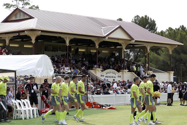 The AFL umpires walk out for the JLT Series match between Crows and Port Adelaide at Memorial Oval, Port Pirie. Picture SARAH REED