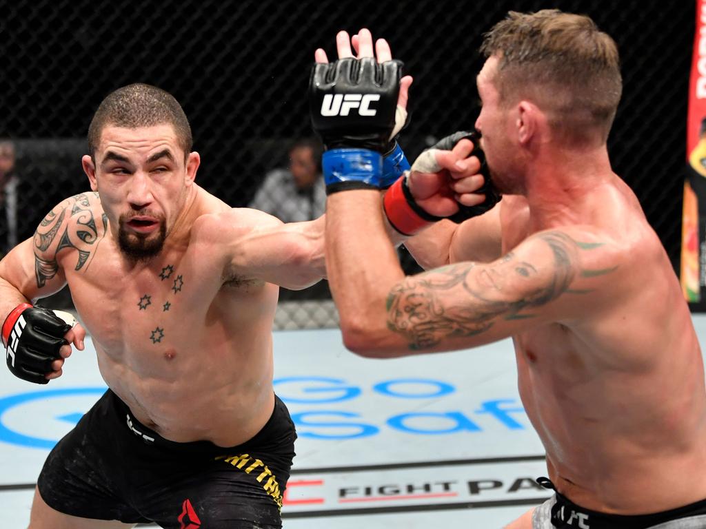 Robert Whittaker punches Darren Till.