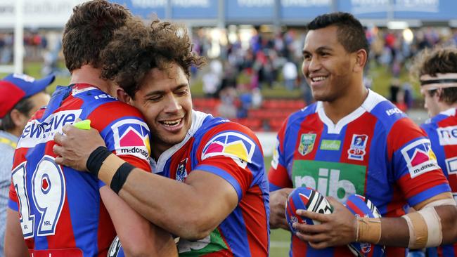 Dane Gagai of the Knights celebrates the win with Samuel Stone after the Round 22 NRL match between the Newcastle Knights and the New Zealand Warriors at McDonald Jones Stadium in Newcastle, Saturday, August 5, 2017. (AAP Image/Darren Pateman) NO ARCHIVING, EDITORIAL USE ONLY