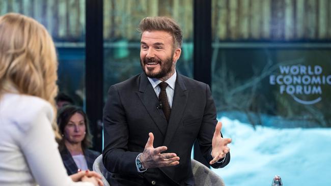 Former England's football player and UNICEF Goodwill Ambassador David Beckham (R) attends a session during the World Economic Forum (WEF) annual meeting in Davos on January 21, 2025. (Photo by FABRICS COFFRINI / AFP)