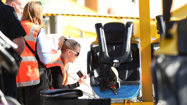 Police and Safework SA inspectors examine the AirMaxx 360 ride.