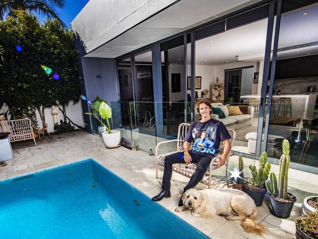 Swimmer Cameron McEvoy is listing his Isle of Capri home for sale and will accept Bitcoin as payment. Cam pictured with his dog Apollo.Picture: NIGEL HALLETT