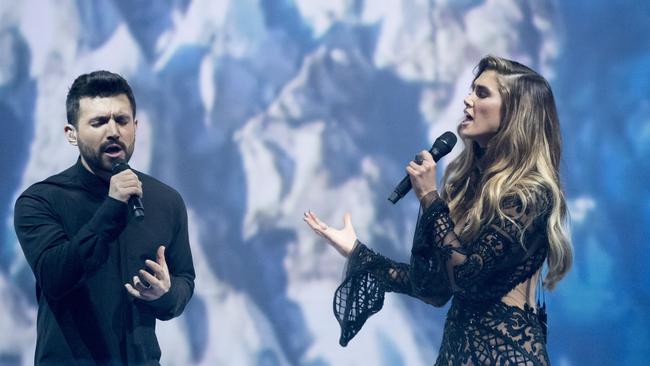 A supplied image obtained Sunday, July 10, 2016 of Alfie Arcuri and Singer and coach Delta Goodrem during the 2016 finale of TV reality show The Voice. Alfie Arcuri, a 28-year-old architect from Sydney, is the winner of The Voice 2016. (AAP Image/Nine Network Australia) NO ARCHIVING, EDITORIAL USE ONLY