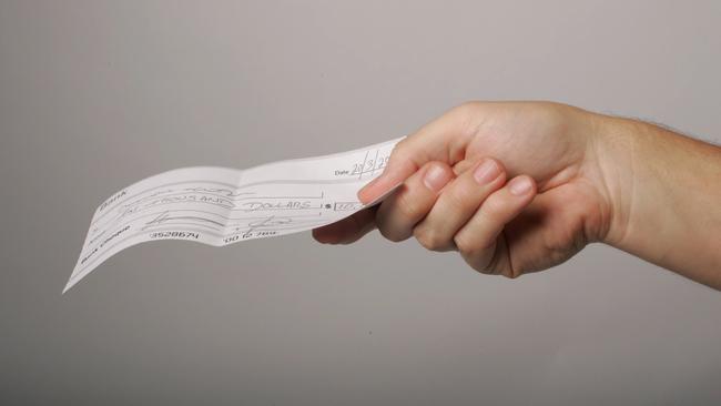 Generic image of a person holding a cheque.