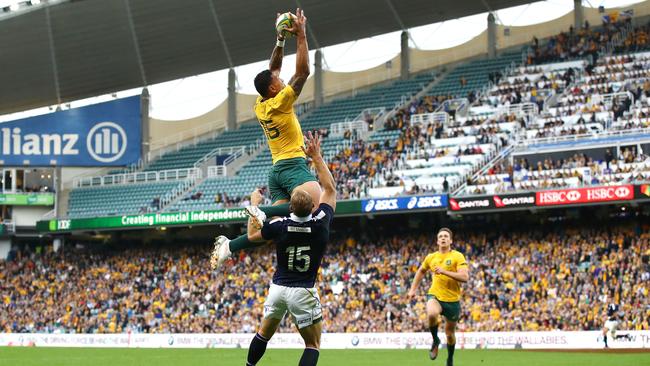 Israel Folau launches himself to claim a Bernard Foley cross-kick and score for the Wallabies against Scotland last month.