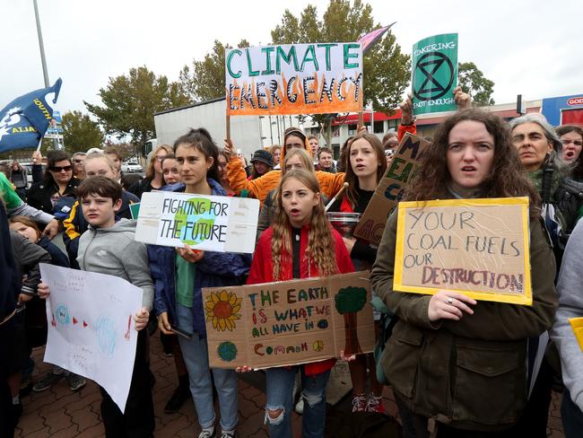 Adelaide Students protest their concerns about climate inaction outside the offices of Simon Birmingham in Adelaide, Friday, May 3, 2019. Thousands of schoolchildren have protested across Australia for serious climate action from the politicians ahead of the May 18 parliamentary elections. (AAP Image/Kelly Barnes) NO ARCHIVING