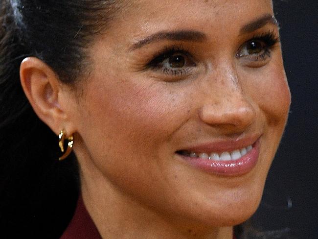 Meghan, the Duchess of Sussex is seen during the medal presentation following the Wheelchair Basketball Final at the Invictus Games in Sydney, Australia, Saturday, October 27, 2018. The Sydney Invictus Games, at which wounded or sick armed services personnel and veterans will compete, will run from Saturday, Oct 20 to Saturday, Oct 27. (AAP Image/Dan Himbrechts) NO ARCHIVING