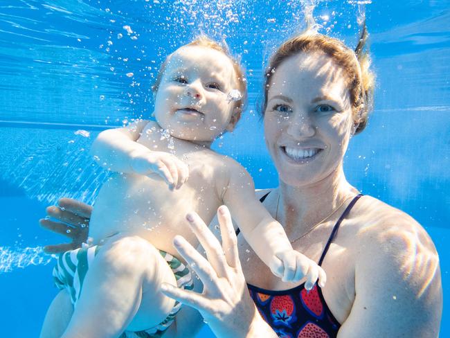 Olympic swimming champion Emily Seebohm swimming with son Sampson at Centenary Pool in Spring Hill. Picture Lachie Millard