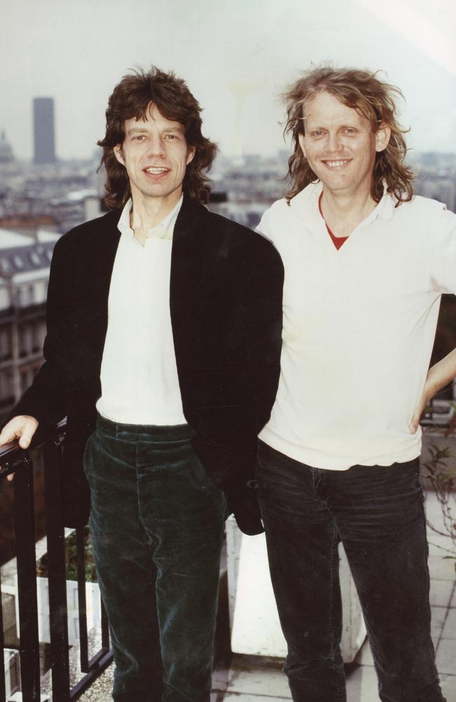 Author Stuart Coupe standing at an even height next to Mick Jagger in Paris. Picture: Supplied.