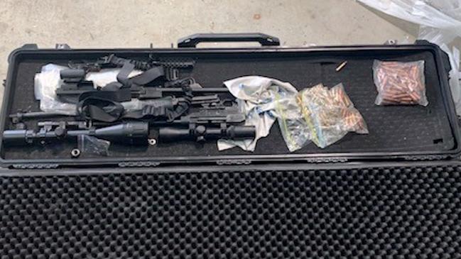 Weapons, drugs and cash were seized during the police raids.