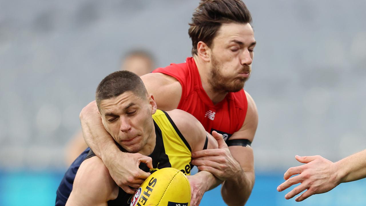 Dion Prestia of the Tigers tackled by Michael Hibberd of the Demons. Picture: Michael Klein